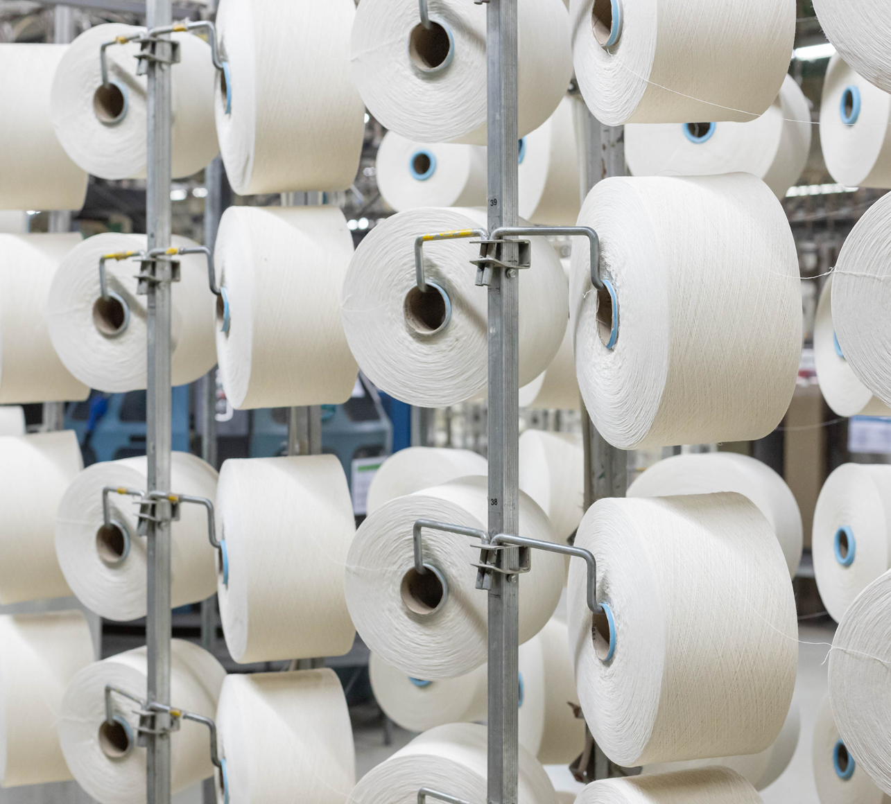 Rolls of processes cotton on racks at the Fruit of the Loom clothing production facility.